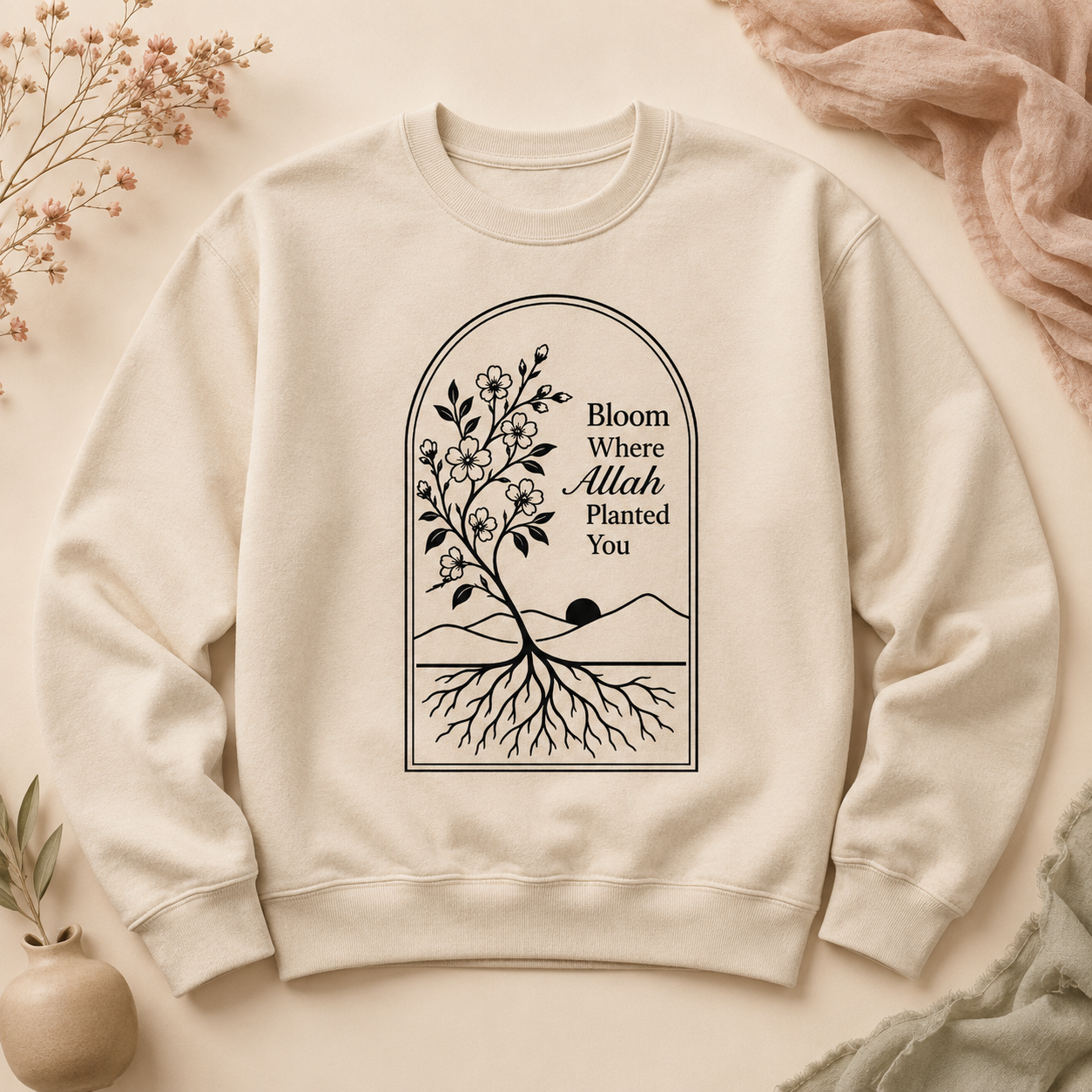 Cream crewneck sweatshirt printed with a blossoming tree and the words Bloom Where Allah Planted You