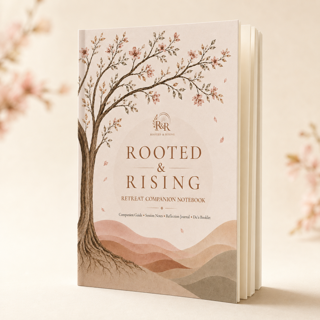 Cherry blossom Rooted and Rising retreat companion notebook standing upright